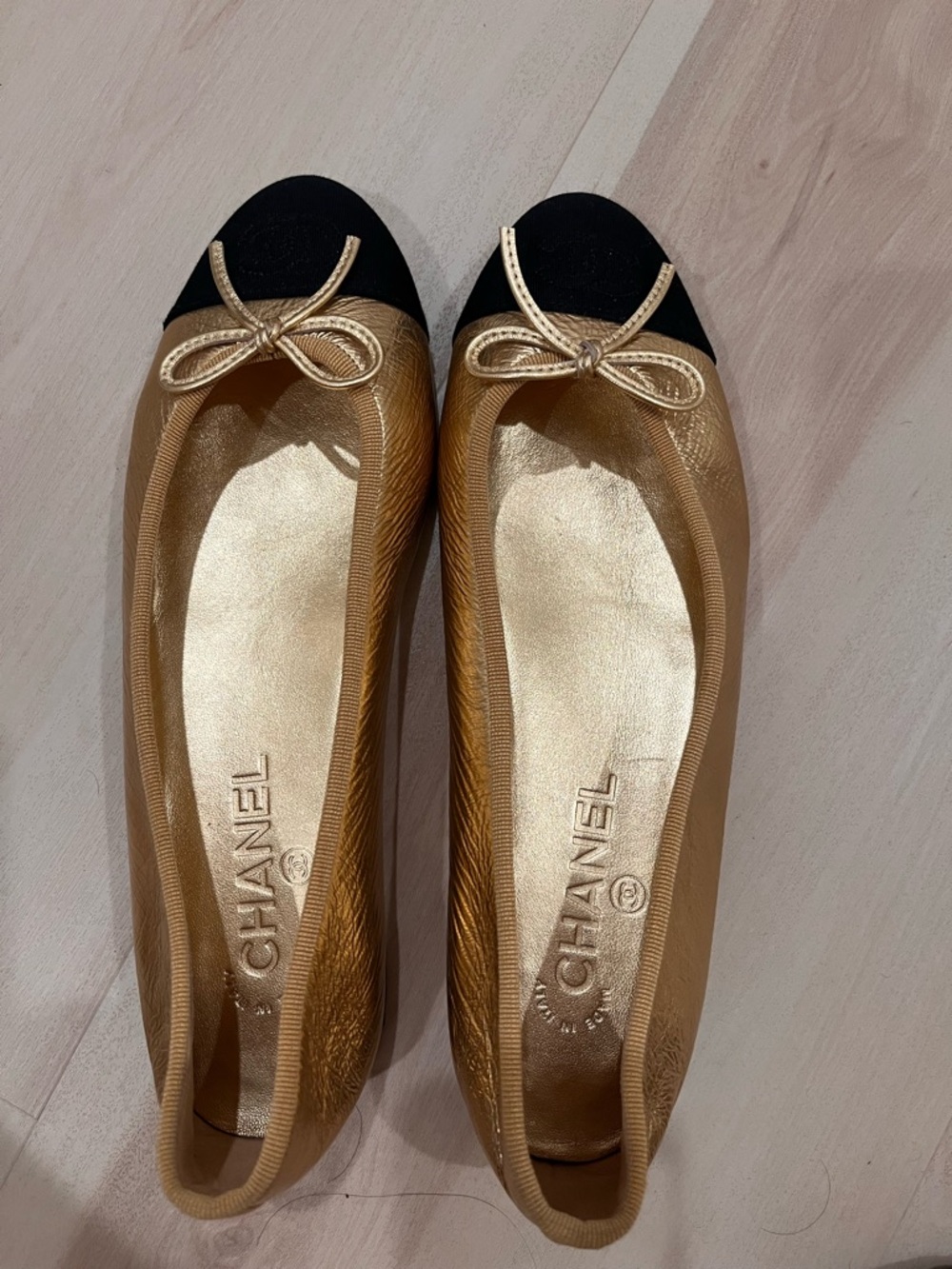 CHANEL Gold and Black Bow Cap-Toe Ballet Flats